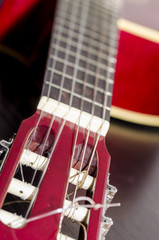 view of a classic guitar head and body. music
