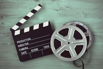 Clapperboards and two reels of film - obrazy, fototapety, plakaty