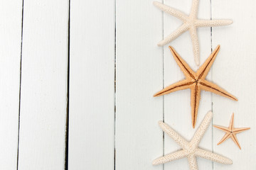 Fototapeta na wymiar starfish on white wood