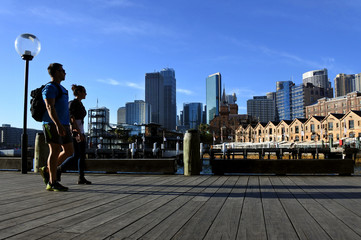 Young couple  walks along Sydney Circular Quay Sydney New South