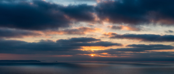 Naklejka na ściany i meble Dramatic sunset over the coast of North Cornwall