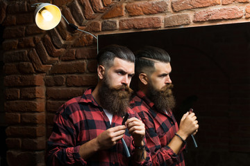 man with razor near mirror