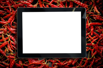 Blabk screen of tablet over Red Chili Pepper,Pill of Dried Chillies Background. - Powered by Adobe