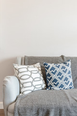 set of pillows onmodern grey sofa in modern living room