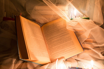 Book and candle light