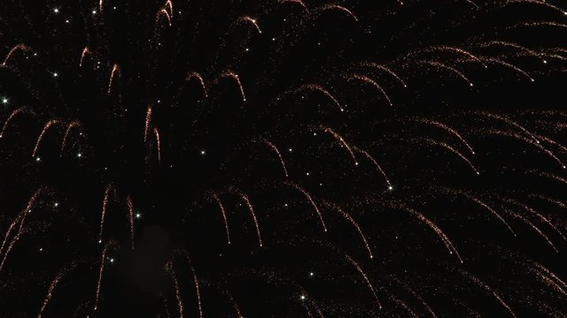 4K close up of firework blasts at night.