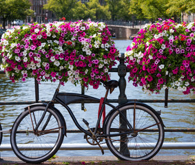 Fototapeta na wymiar Traditional Dutch bike parked on an Amsterdam canal