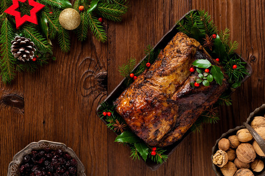 Roast pork loin with Christmas decoration.