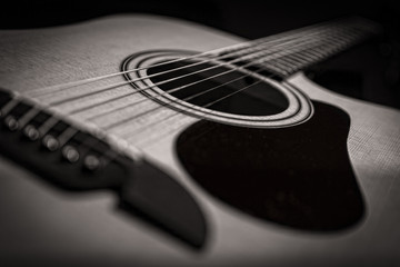 Acoustic guitar closeup in black and white