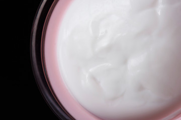 Cream on pink container