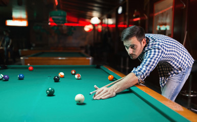 Man playing pool in pub