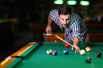 Man playing pool in pub