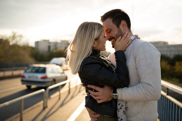 Romantic couple in love enjoying sunset