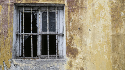 Fototapeta na wymiar broken window of an abandoned building
