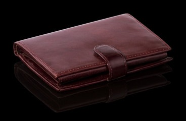 burgundy purse on a black background