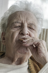 senior woman eating something