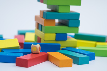 Fototapeta premium Colorful wood blocks stack game with color dice