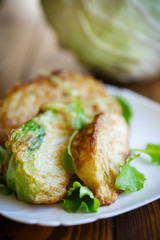 cabbage pieces fried in batter with salad