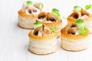 vol-au-vents  puff pastry cases filled with mushrooms and chicke