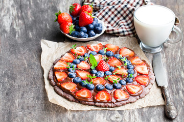 Homemade  chocolate natural fruit pizza with berries