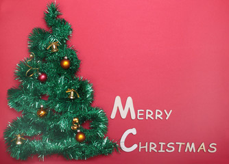 Fototapeta na wymiar Closeup of Christmas tree on red background