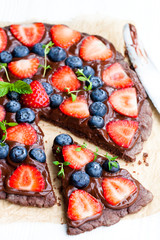 Homemade  chocolate natural fruit pizza with berries