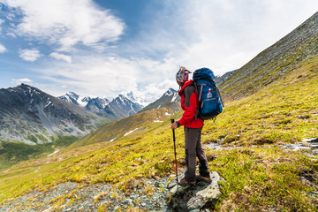 Fototapeta na wymiar Hiker in highlands of Altai mountains, Russia