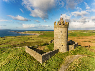 Aerial Famous Irish Tourist Attraction In Doolin, County Clare, Ireland. Doonagore Castle is a...
