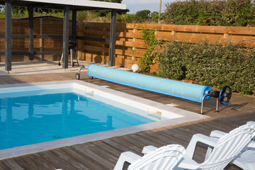Beautiful swimming pool in the garden in the park.