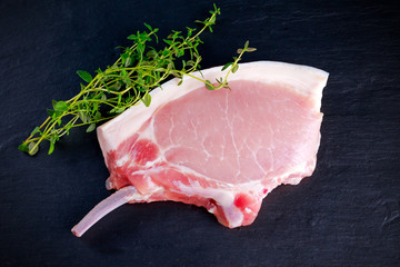 Top view Raw pork cutlet close up. on stone background