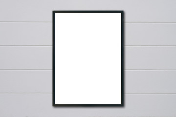 Mock up blank frame hanging on wall in room