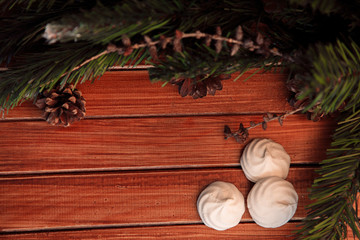 Christmas background on wood.  gift and marshmallows