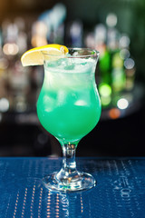 Blue coctail decorate by lemon.Classic alcohol cocktails, cocktails at the bar, alcoholic drinks, soft drinks, tasty cocktails