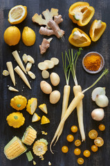 Fototapeta na wymiar Overhead food series of assorted yellow toned vegetables, fresh