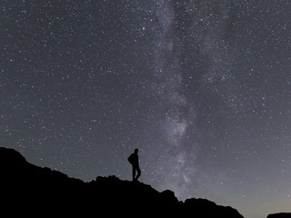 beauty Milky way landscape on square format with man silhouette