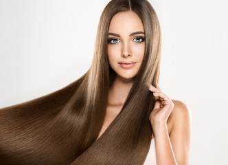 Beautiful blonde woman with long, healthy , straight  and shiny hair.  Hairstyle loose hair 