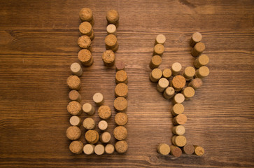 Glass and bottle made cork wine on wood table

