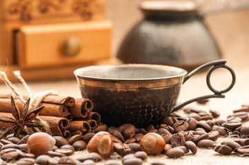 Coffee in vintage cup served with spices