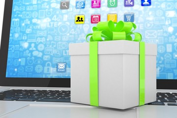 Gift box with ribbon on laptop keyboard. 3d rendering.