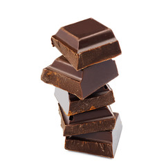 Dark chocolate cubes isolated on white background.