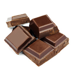 Dark chocolate cubes isolated on white background.