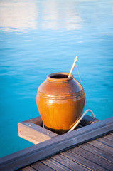 Fototapeta premium Clay pot near the sea, part of a spa center