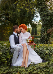 Beautiful girl and a man sitting in garden