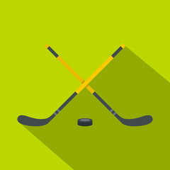 Fototapeta na wymiar Sticks and puck icon. Flat illustration of sticks and puck vector icon for web design