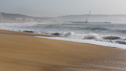 Sunny beach on the Atlantic coast in Nazare, Portugal