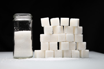 sugar cubes/ wall of sugar cubes on a black background