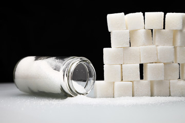 sugar cubes/ wall of sugar cubes on a black background