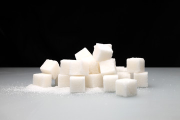 sugar cubes/ wall of sugar cubes on a black background