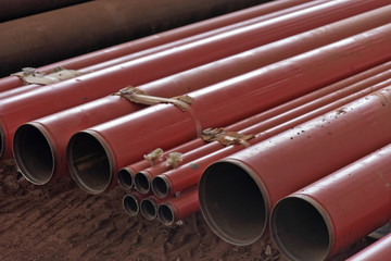 Fototapeta premium Pile of red conduit to install on building