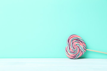 Sweet lollipop on a green background
